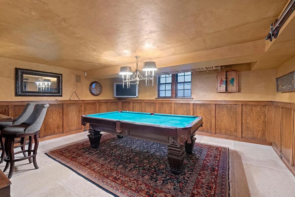 The Mansion in Shorewood offers beautiful backyard with outdoor granite Kit, pergola dining area and Firepit, now available for sale. This home located at 4496 North Lake Dr, Shorewood, Wisconsin