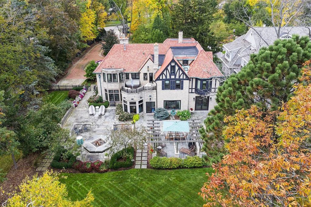 The Mansion in Shorewood offers beautiful backyard with outdoor granite Kit, pergola dining area and Firepit, now available for sale. This home located at 4496 North Lake Dr, Shorewood, Wisconsin