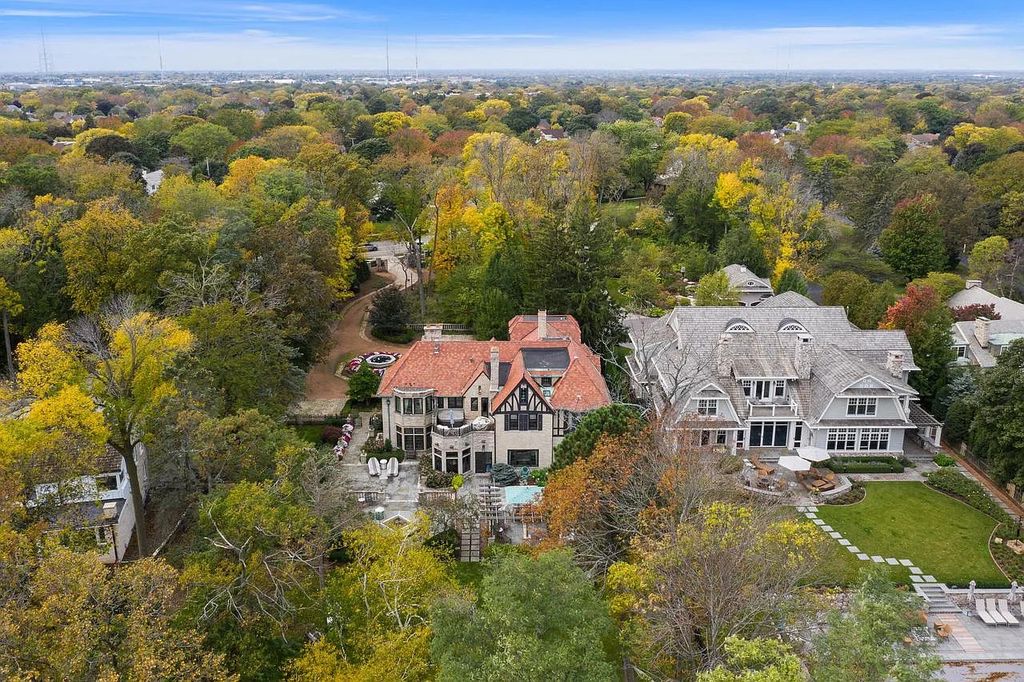 The Mansion in Shorewood offers beautiful backyard with outdoor granite Kit, pergola dining area and Firepit, now available for sale. This home located at 4496 North Lake Dr, Shorewood, Wisconsin