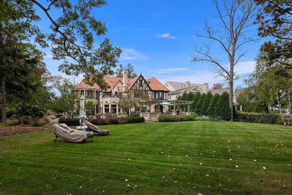 The Mansion in Shorewood offers beautiful backyard with outdoor granite Kit, pergola dining area and Firepit, now available for sale. This home located at 4496 North Lake Dr, Shorewood, Wisconsin