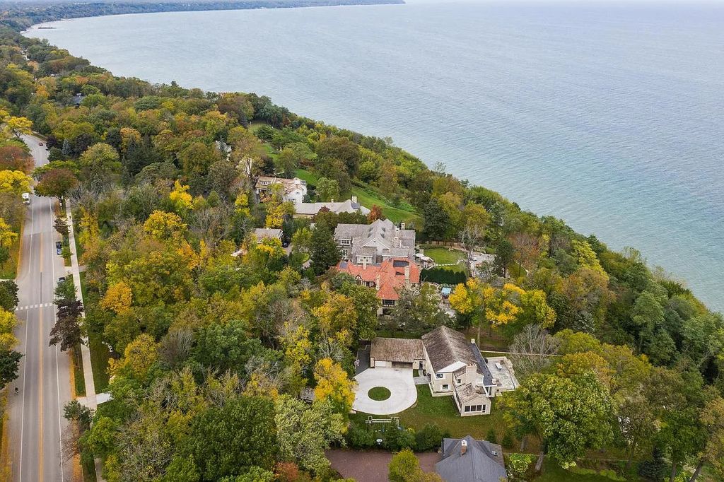 The Mansion in Shorewood offers beautiful backyard with outdoor granite Kit, pergola dining area and Firepit, now available for sale. This home located at 4496 North Lake Dr, Shorewood, Wisconsin