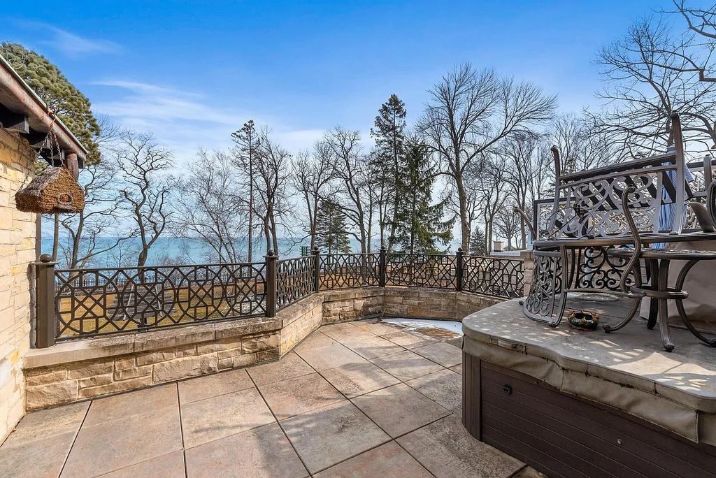 The Mansion in Shorewood offers beautiful backyard with outdoor granite Kit, pergola dining area and Firepit, now available for sale. This home located at 4496 North Lake Dr, Shorewood, Wisconsin