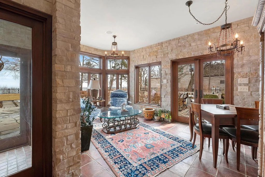 The Mansion in Shorewood offers beautiful backyard with outdoor granite Kit, pergola dining area and Firepit, now available for sale. This home located at 4496 North Lake Dr, Shorewood, Wisconsin