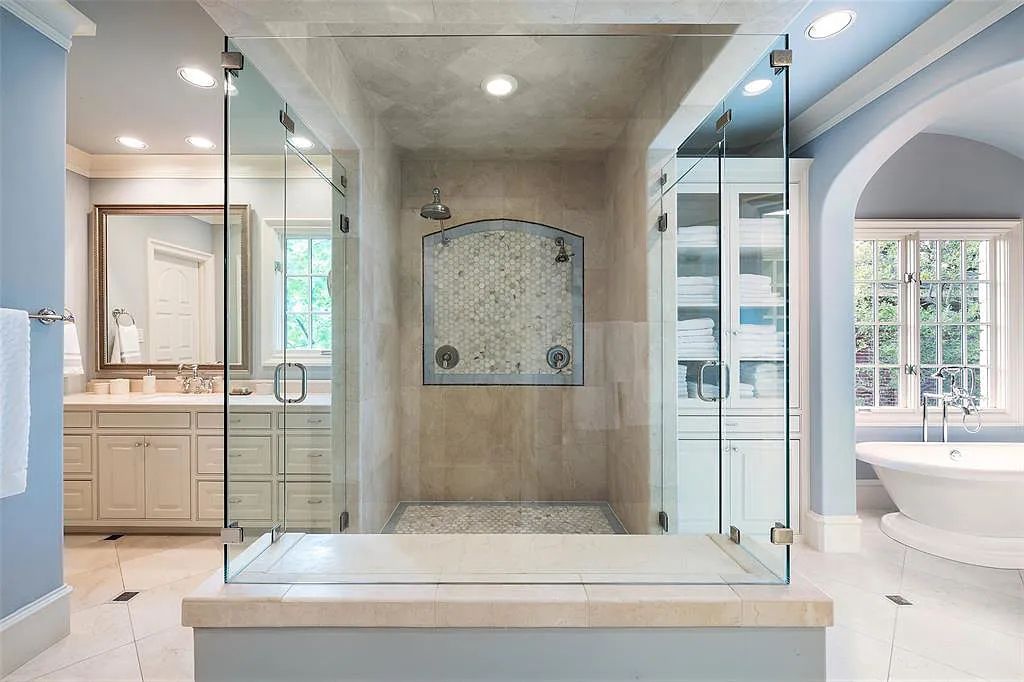 3837 Greenbrier Drive, Dallas, Texas is a fabulous property in the middle of the fairway between 2 parks with features includes top-of-the-line Chefs kitchen, bed en-suites, large game room, heated pool, elevator, front yard stone entertaining terrace, designated dog run and more.