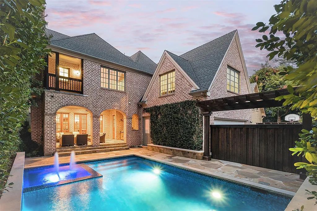 3837 Greenbrier Drive, Dallas, Texas is a fabulous property in the middle of the fairway between 2 parks with features includes top-of-the-line Chefs kitchen, bed en-suites, large game room, heated pool, elevator, front yard stone entertaining terrace, designated dog run and more.