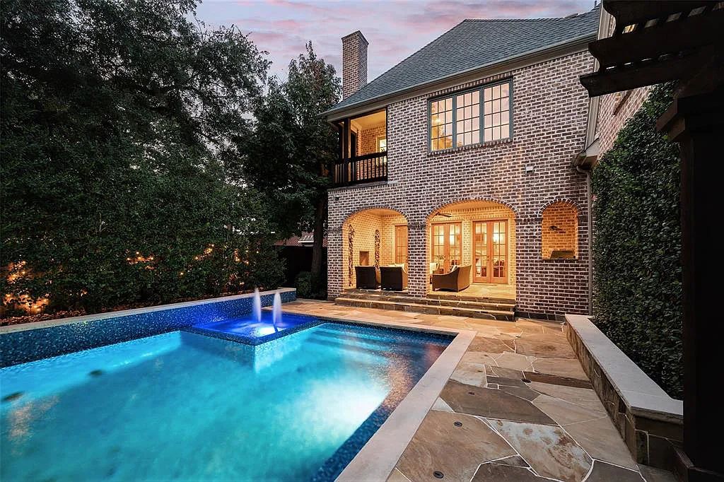 3837 Greenbrier Drive, Dallas, Texas is a fabulous property in the middle of the fairway between 2 parks with features includes top-of-the-line Chefs kitchen, bed en-suites, large game room, heated pool, elevator, front yard stone entertaining terrace, designated dog run and more.