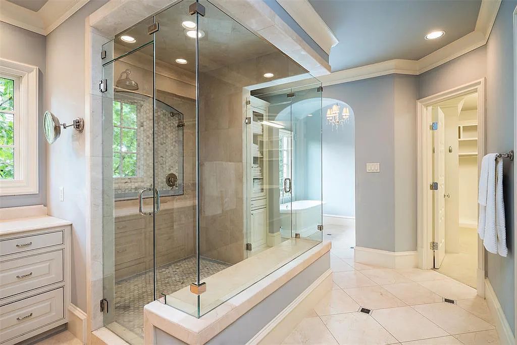 3837 Greenbrier Drive, Dallas, Texas is a fabulous property in the middle of the fairway between 2 parks with features includes top-of-the-line Chefs kitchen, bed en-suites, large game room, heated pool, elevator, front yard stone entertaining terrace, designated dog run and more.