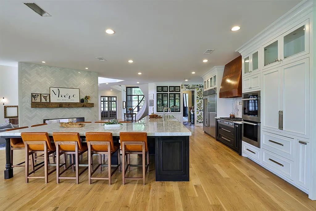 5801 Cypress Point Dr, Fort Worth, Texas is stunning remodeled estate in guarded and gated Mira Vista community on a cul-de-sac lot overlooking the 7th tee box, green and lake.