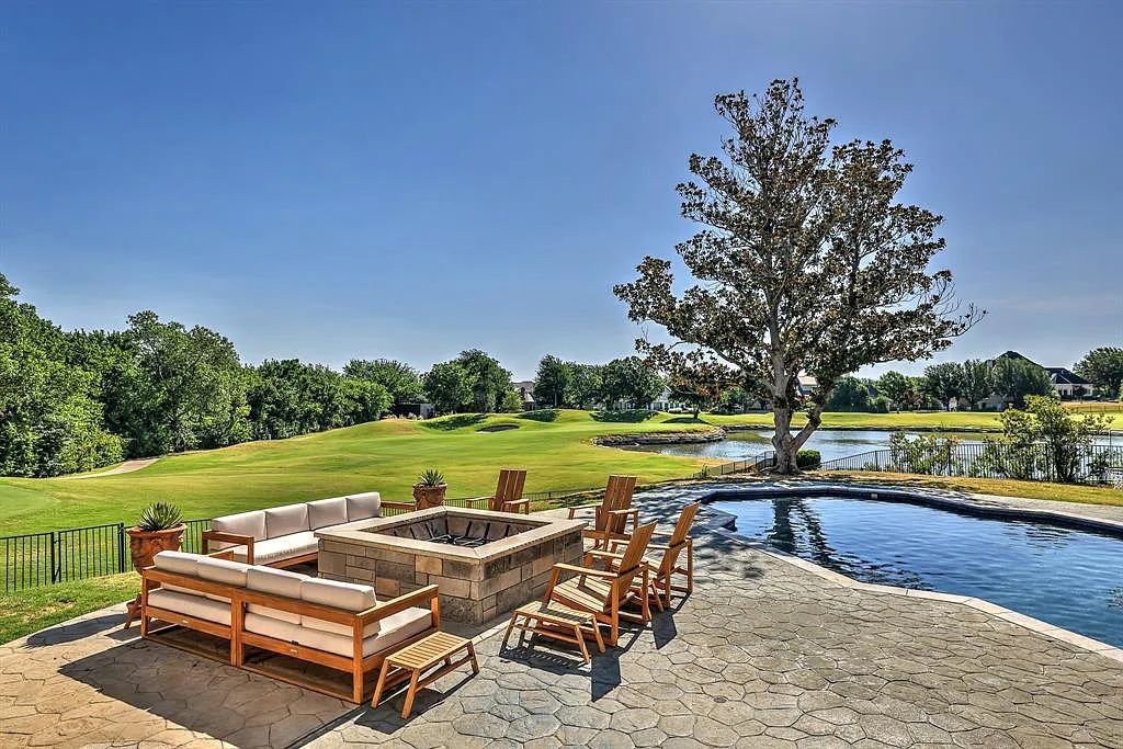 5801 Cypress Point Dr, Fort Worth, Texas is stunning remodeled estate in guarded and gated Mira Vista community on a cul-de-sac lot overlooking the 7th tee box, green and lake.