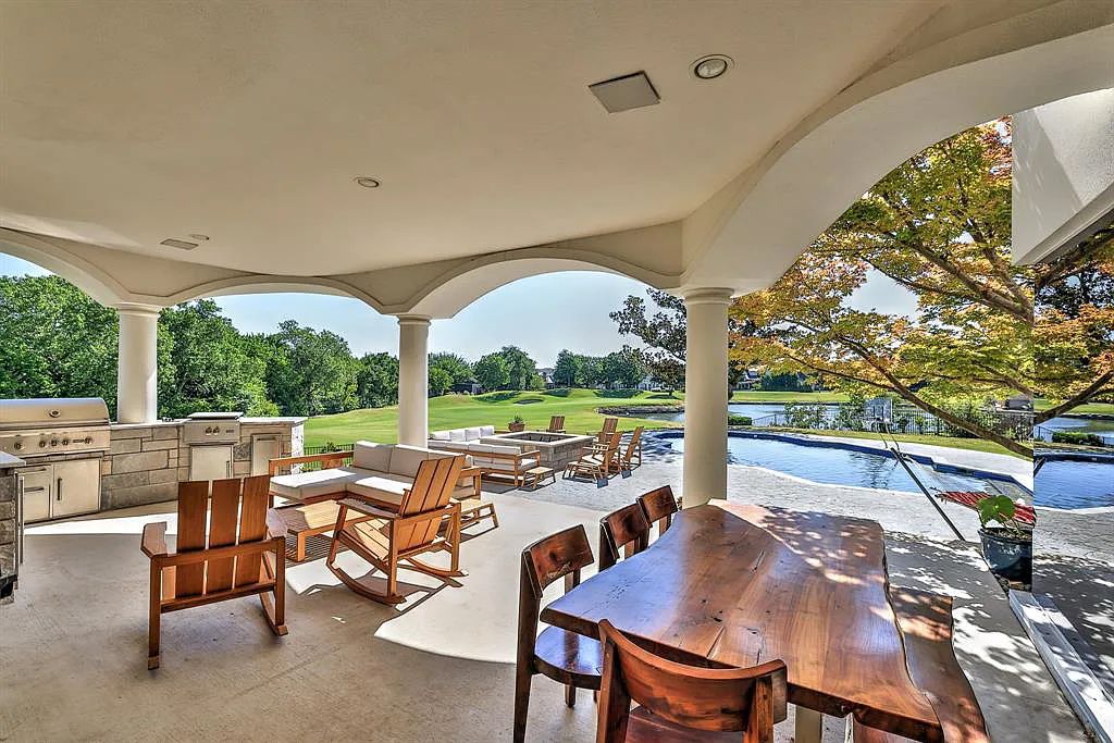 5801 Cypress Point Dr, Fort Worth, Texas is stunning remodeled estate in guarded and gated Mira Vista community on a cul-de-sac lot overlooking the 7th tee box, green and lake.