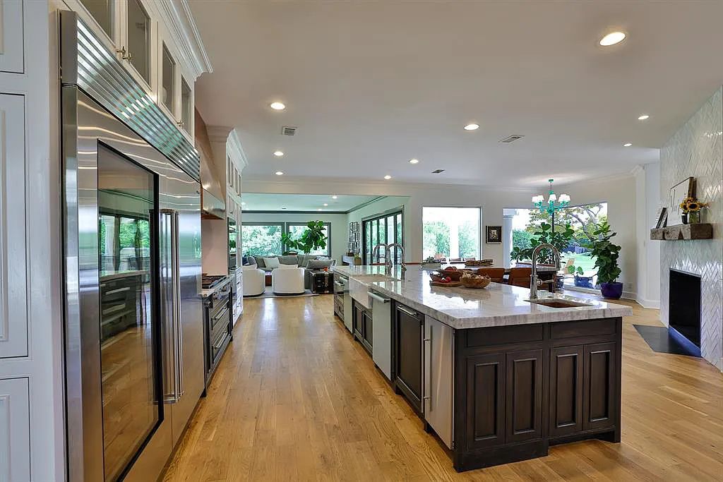 5801 Cypress Point Dr, Fort Worth, Texas is stunning remodeled estate in guarded and gated Mira Vista community on a cul-de-sac lot overlooking the 7th tee box, green and lake.