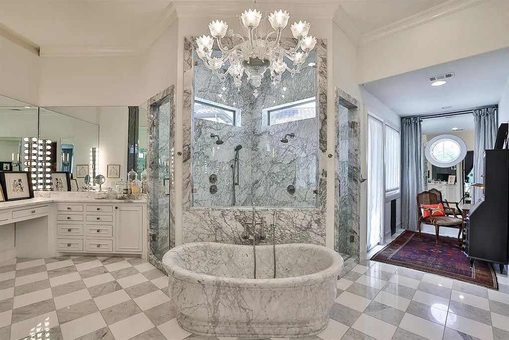 5801 Cypress Point Dr, Fort Worth, Texas is stunning remodeled estate in guarded and gated Mira Vista community on a cul-de-sac lot overlooking the 7th tee box, green and lake.