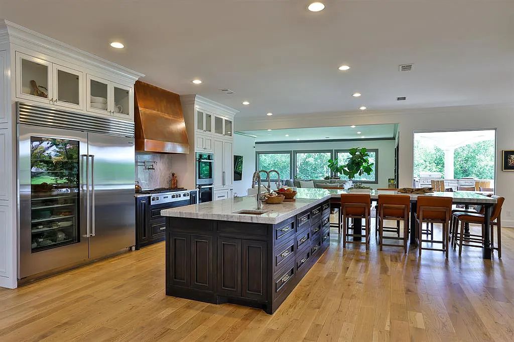 5801 Cypress Point Dr, Fort Worth, Texas is stunning remodeled estate in guarded and gated Mira Vista community on a cul-de-sac lot overlooking the 7th tee box, green and lake.