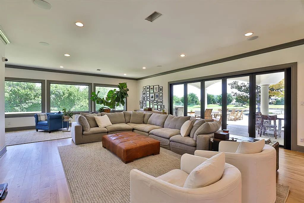 5801 Cypress Point Dr, Fort Worth, Texas is stunning remodeled estate in guarded and gated Mira Vista community on a cul-de-sac lot overlooking the 7th tee box, green and lake.