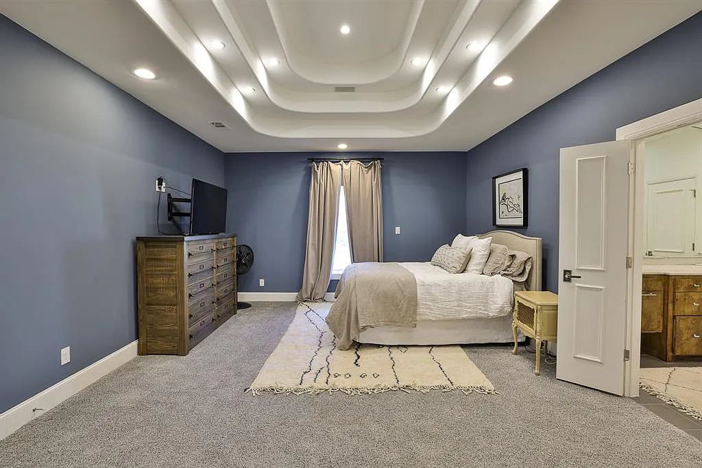 5801 Cypress Point Dr, Fort Worth, Texas is stunning remodeled estate in guarded and gated Mira Vista community on a cul-de-sac lot overlooking the 7th tee box, green and lake.