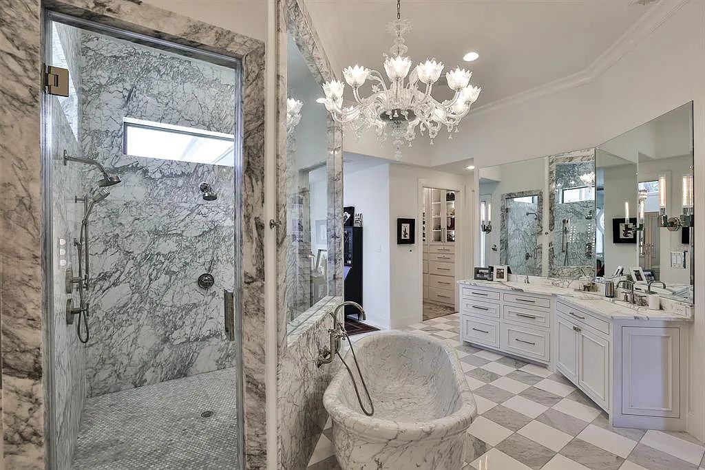 5801 Cypress Point Dr, Fort Worth, Texas is stunning remodeled estate in guarded and gated Mira Vista community on a cul-de-sac lot overlooking the 7th tee box, green and lake.