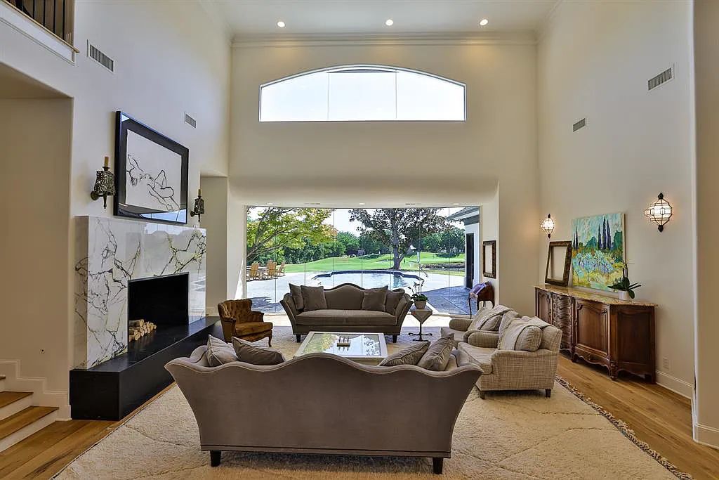 5801 Cypress Point Dr, Fort Worth, Texas is stunning remodeled estate in guarded and gated Mira Vista community on a cul-de-sac lot overlooking the 7th tee box, green and lake.