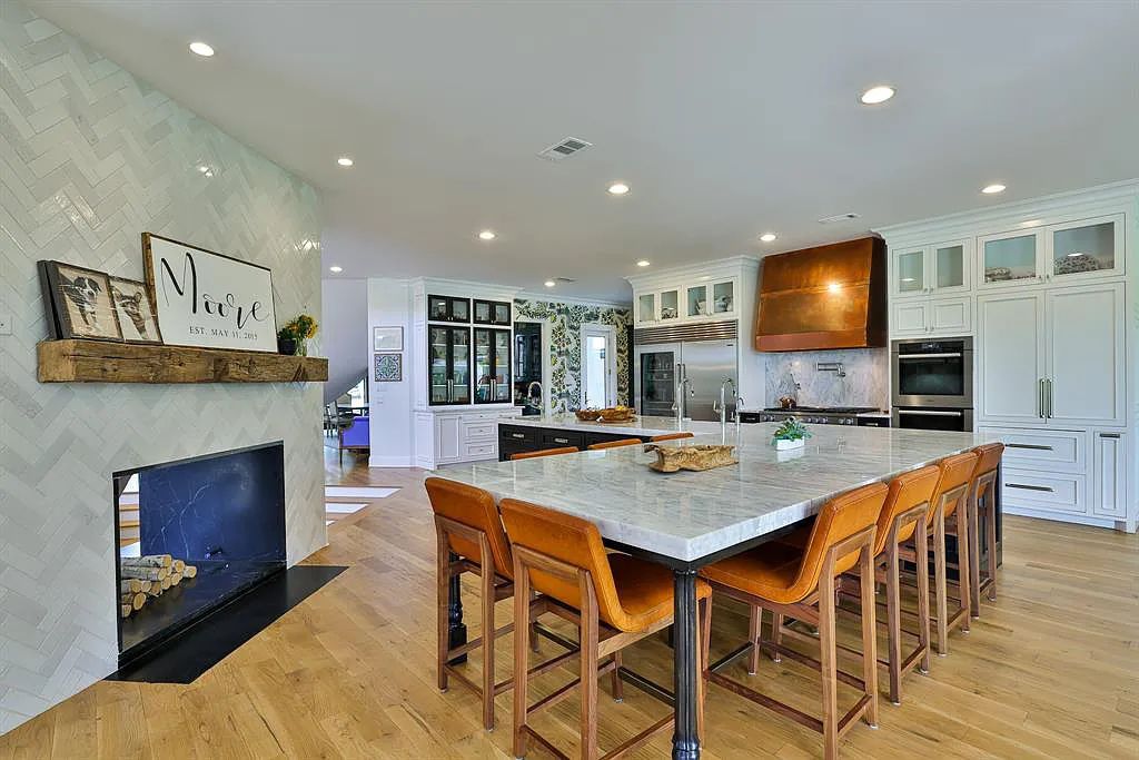 5801 Cypress Point Dr, Fort Worth, Texas is stunning remodeled estate in guarded and gated Mira Vista community on a cul-de-sac lot overlooking the 7th tee box, green and lake.