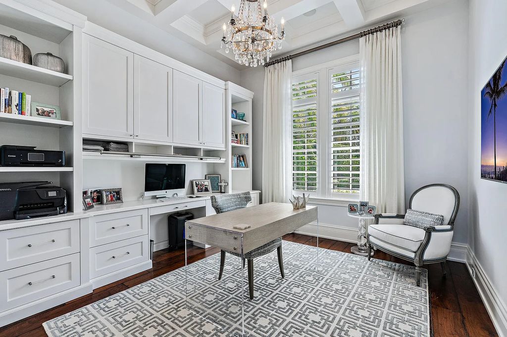 The Estate in Jupiter, a luxurious home on a quiet cul-de-sac street close to The Club features perfect outdoor living space including covered and screen outdoor living room with summer kitchen, fireplace, amazing water view pool is now available for sale. This home located at 109 Schooner Ln, Jupiter, Florida