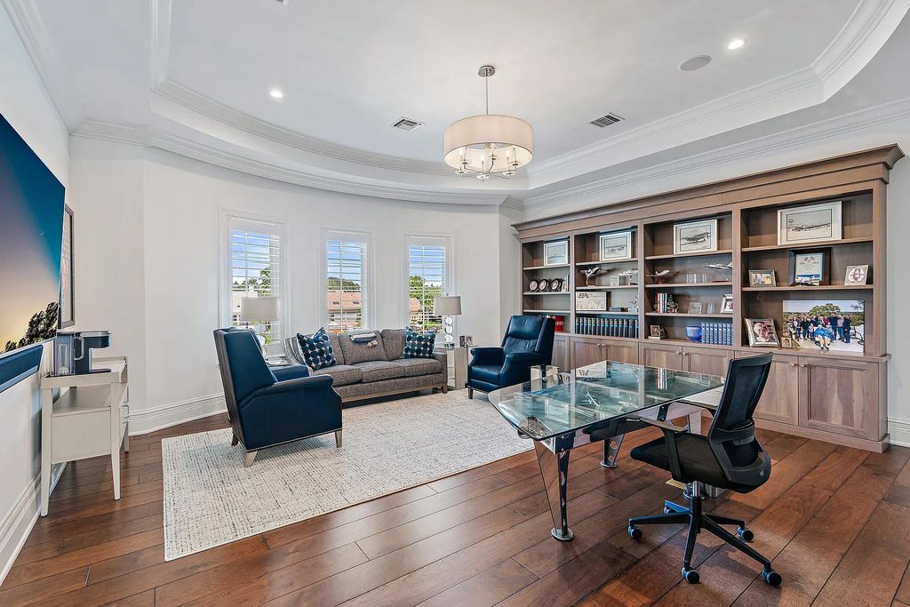 The Estate in Jupiter, a luxurious home on a quiet cul-de-sac street close to The Club features perfect outdoor living space including covered and screen outdoor living room with summer kitchen, fireplace, amazing water view pool is now available for sale. This home located at 109 Schooner Ln, Jupiter, Florida