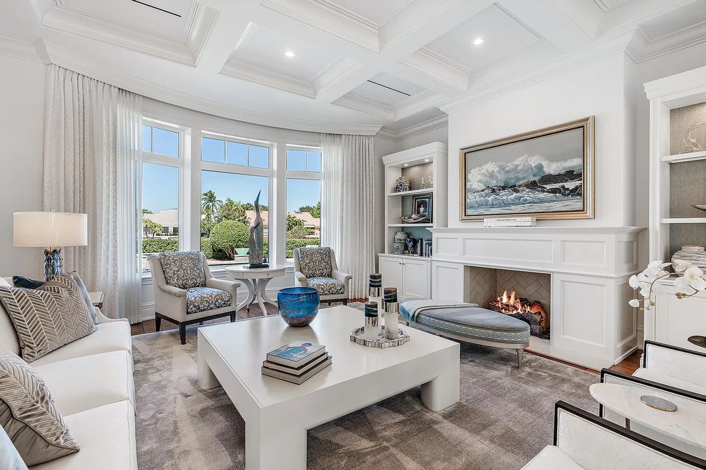 The Estate in Jupiter, a luxurious home on a quiet cul-de-sac street close to The Club features perfect outdoor living space including covered and screen outdoor living room with summer kitchen, fireplace, amazing water view pool is now available for sale. This home located at 109 Schooner Ln, Jupiter, Florida