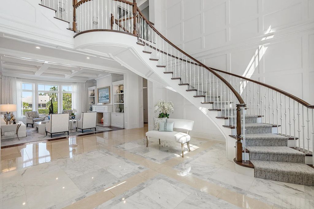 The Estate in Jupiter, a luxurious home on a quiet cul-de-sac street close to The Club features perfect outdoor living space including covered and screen outdoor living room with summer kitchen, fireplace, amazing water view pool is now available for sale. This home located at 109 Schooner Ln, Jupiter, Florida