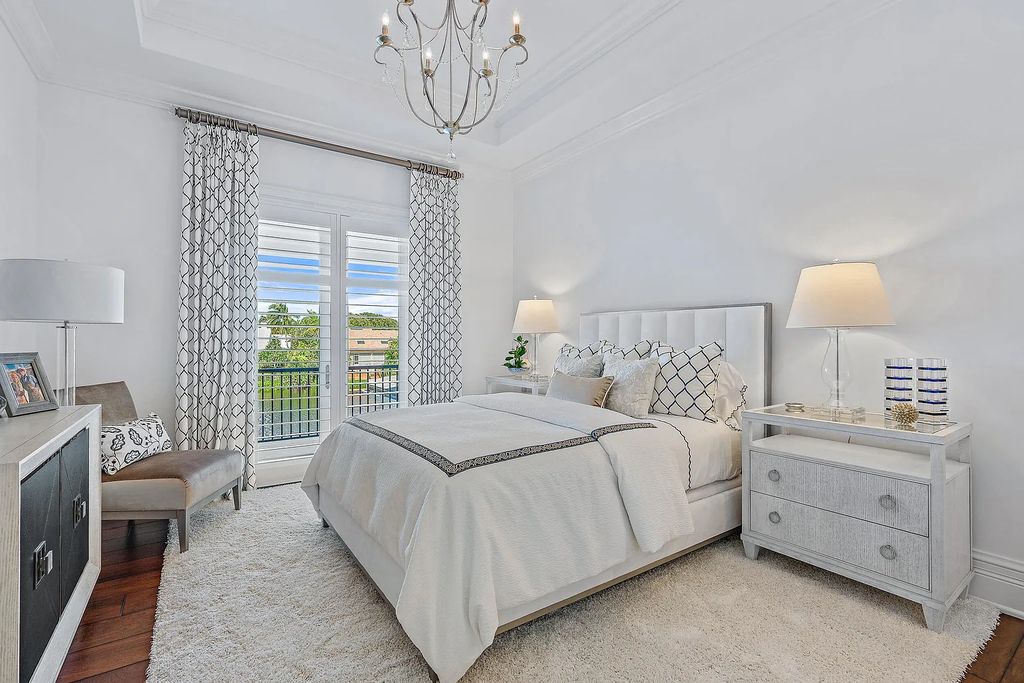 The Estate in Jupiter, a luxurious home on a quiet cul-de-sac street close to The Club features perfect outdoor living space including covered and screen outdoor living room with summer kitchen, fireplace, amazing water view pool is now available for sale. This home located at 109 Schooner Ln, Jupiter, Florida