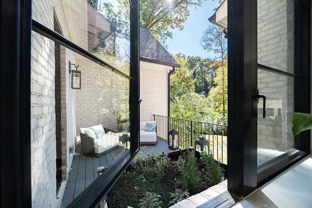 The Property in Atlanta boasts both a main & upper-level luxurious, primary suite, an elevator, hard to find 5 car, now available for sale. This home located at 4220 Harris Trl NW, Atlanta, Georgia