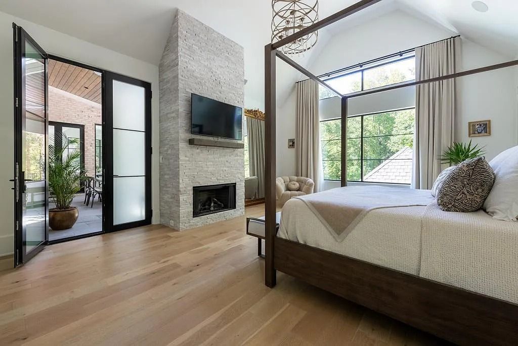 The Property in Atlanta boasts both a main & upper-level luxurious, primary suite, an elevator, hard to find 5 car, now available for sale. This home located at 4220 Harris Trl NW, Atlanta, Georgia