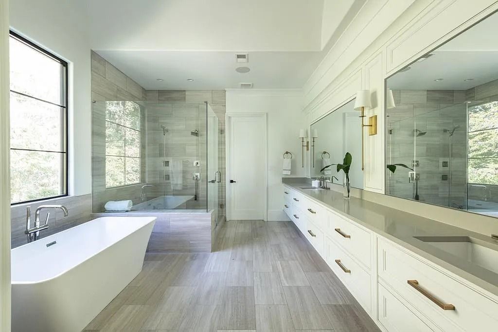 The Property in Atlanta boasts both a main & upper-level luxurious, primary suite, an elevator, hard to find 5 car, now available for sale. This home located at 4220 Harris Trl NW, Atlanta, Georgia