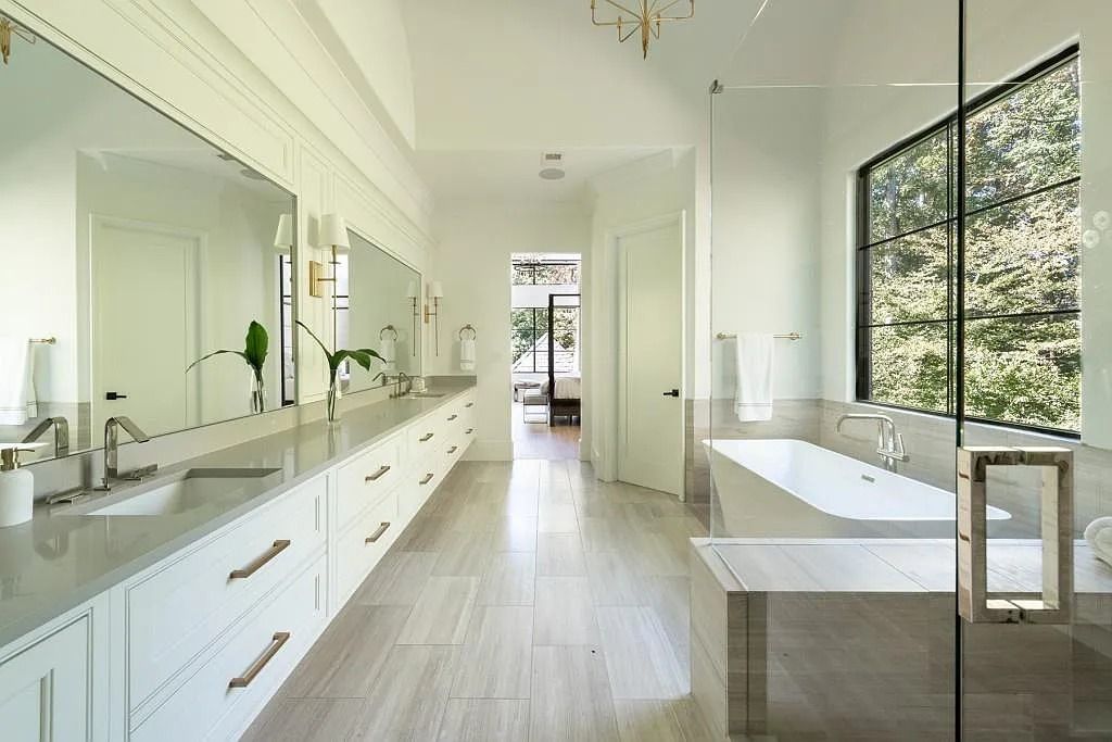 The Property in Atlanta boasts both a main & upper-level luxurious, primary suite, an elevator, hard to find 5 car, now available for sale. This home located at 4220 Harris Trl NW, Atlanta, Georgia