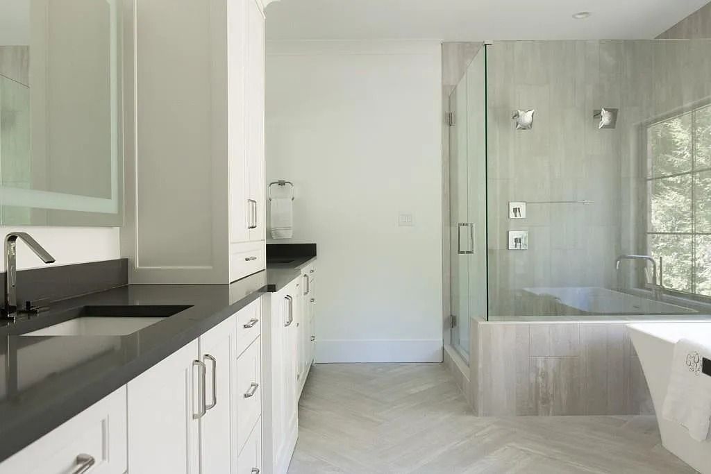 The Property in Atlanta boasts both a main & upper-level luxurious, primary suite, an elevator, hard to find 5 car, now available for sale. This home located at 4220 Harris Trl NW, Atlanta, Georgia
