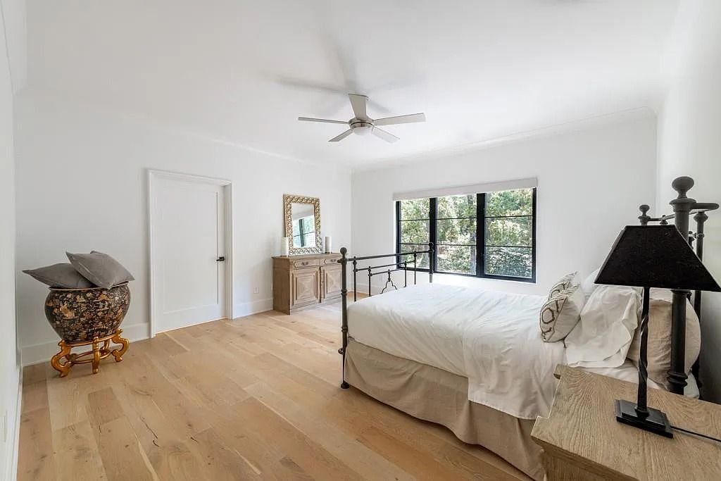 The Property in Atlanta boasts both a main & upper-level luxurious, primary suite, an elevator, hard to find 5 car, now available for sale. This home located at 4220 Harris Trl NW, Atlanta, Georgia