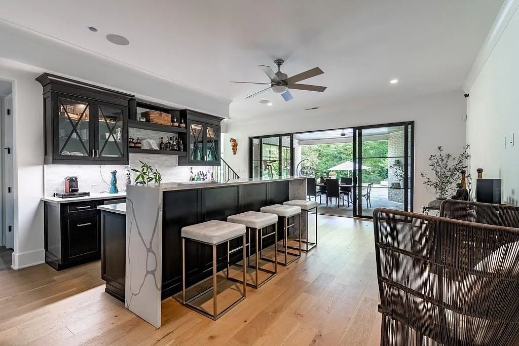 The Property in Atlanta boasts both a main & upper-level luxurious, primary suite, an elevator, hard to find 5 car, now available for sale. This home located at 4220 Harris Trl NW, Atlanta, Georgia
