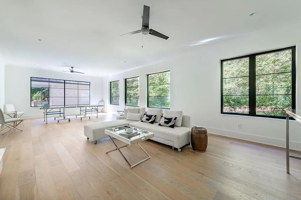 The Property in Atlanta boasts both a main & upper-level luxurious, primary suite, an elevator, hard to find 5 car, now available for sale. This home located at 4220 Harris Trl NW, Atlanta, Georgia