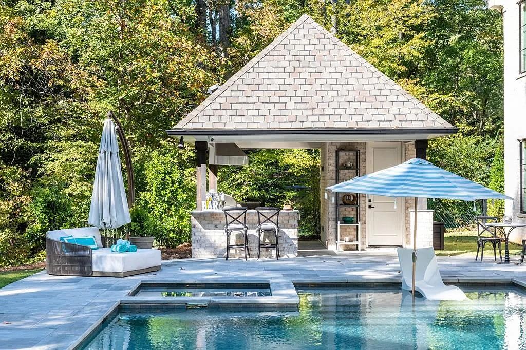 The Property in Atlanta boasts both a main & upper-level luxurious, primary suite, an elevator, hard to find 5 car, now available for sale. This home located at 4220 Harris Trl NW, Atlanta, Georgia