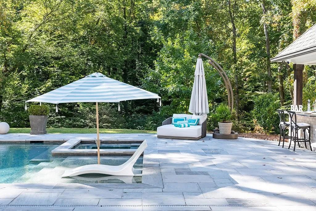 The Property in Atlanta boasts both a main & upper-level luxurious, primary suite, an elevator, hard to find 5 car, now available for sale. This home located at 4220 Harris Trl NW, Atlanta, Georgia