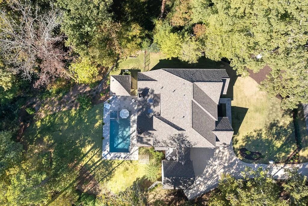 The Property in Atlanta boasts both a main & upper-level luxurious, primary suite, an elevator, hard to find 5 car, now available for sale. This home located at 4220 Harris Trl NW, Atlanta, Georgia