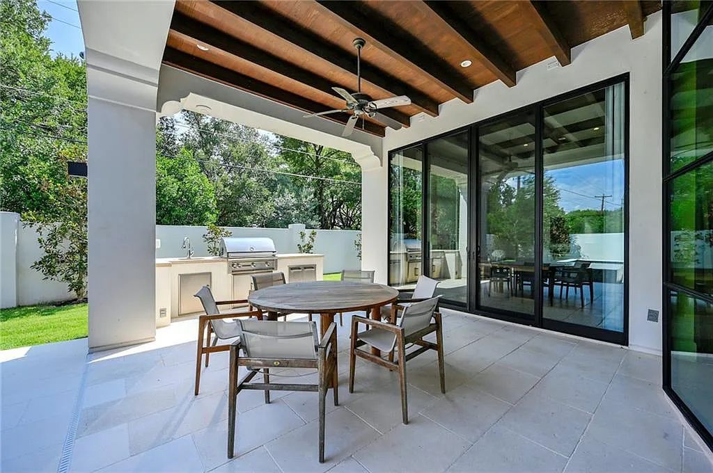 The Home in Austin, an immaculate modern estate nestled in the peaceful and tree-filled neighborhood of Rollingwood features resort-style backyard with a pool and spa, a covered outdoor kitchen is now available for sale. This home located at 4713 Timberline Dr, Austin, Texas