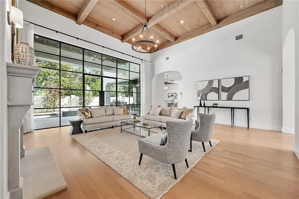 The Home in Austin, an immaculate modern estate nestled in the peaceful and tree-filled neighborhood of Rollingwood features resort-style backyard with a pool and spa, a covered outdoor kitchen is now available for sale. This home located at 4713 Timberline Dr, Austin, Texas
