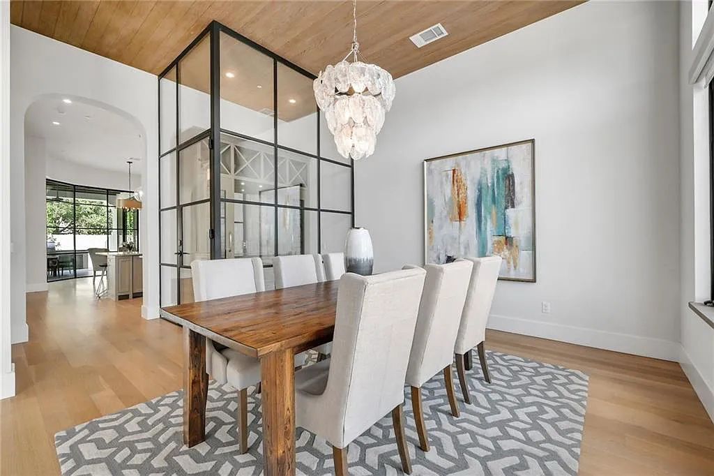 The Home in Austin, an immaculate modern estate nestled in the peaceful and tree-filled neighborhood of Rollingwood features resort-style backyard with a pool and spa, a covered outdoor kitchen is now available for sale. This home located at 4713 Timberline Dr, Austin, Texas