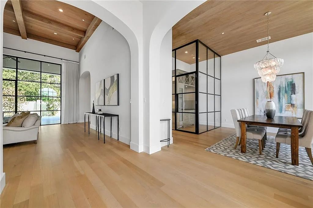 The Home in Austin, an immaculate modern estate nestled in the peaceful and tree-filled neighborhood of Rollingwood features resort-style backyard with a pool and spa, a covered outdoor kitchen is now available for sale. This home located at 4713 Timberline Dr, Austin, Texas