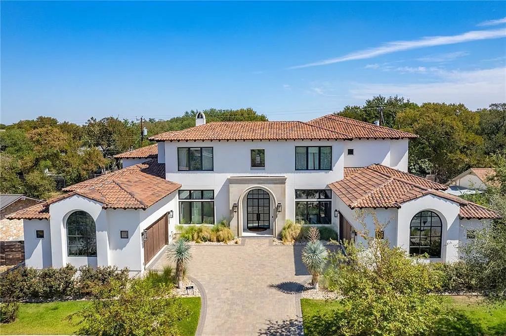 The Home in Austin, an immaculate modern estate nestled in the peaceful and tree-filled neighborhood of Rollingwood features resort-style backyard with a pool and spa, a covered outdoor kitchen is now available for sale. This home located at 4713 Timberline Dr, Austin, Texas