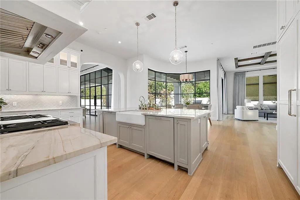 The Home in Austin, an immaculate modern estate nestled in the peaceful and tree-filled neighborhood of Rollingwood features resort-style backyard with a pool and spa, a covered outdoor kitchen is now available for sale. This home located at 4713 Timberline Dr, Austin, Texas