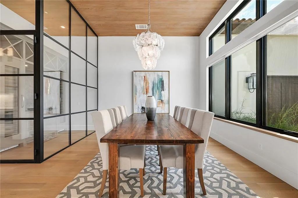 The Home in Austin, an immaculate modern estate nestled in the peaceful and tree-filled neighborhood of Rollingwood features resort-style backyard with a pool and spa, a covered outdoor kitchen is now available for sale. This home located at 4713 Timberline Dr, Austin, Texas