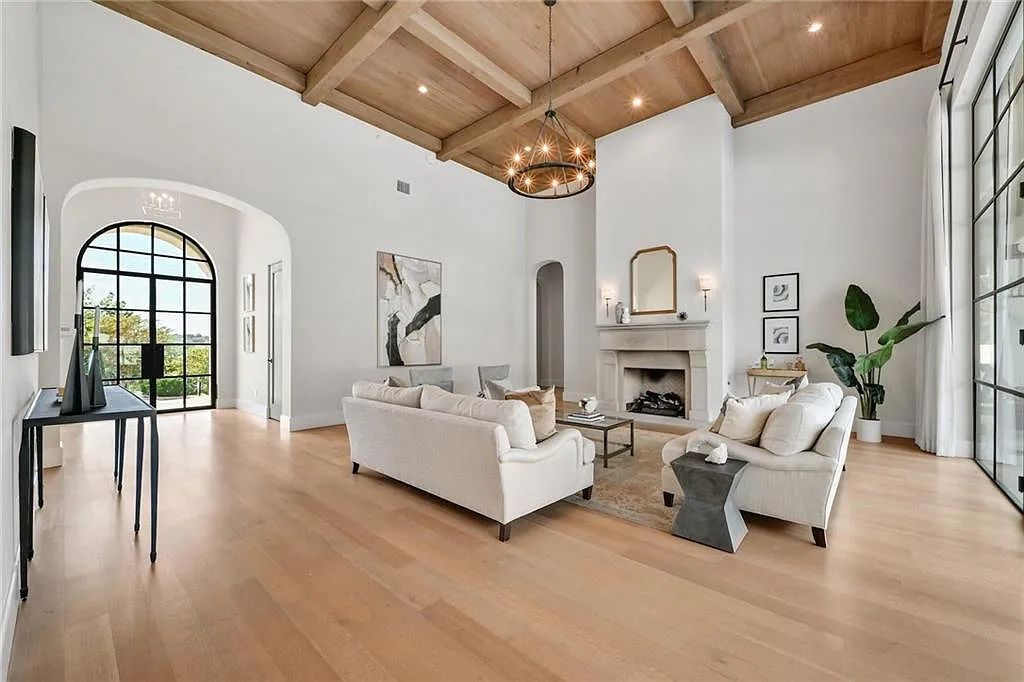 The Home in Austin, an immaculate modern estate nestled in the peaceful and tree-filled neighborhood of Rollingwood features resort-style backyard with a pool and spa, a covered outdoor kitchen is now available for sale. This home located at 4713 Timberline Dr, Austin, Texas