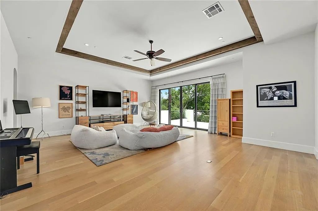 The Home in Austin, an immaculate modern estate nestled in the peaceful and tree-filled neighborhood of Rollingwood features resort-style backyard with a pool and spa, a covered outdoor kitchen is now available for sale. This home located at 4713 Timberline Dr, Austin, Texas