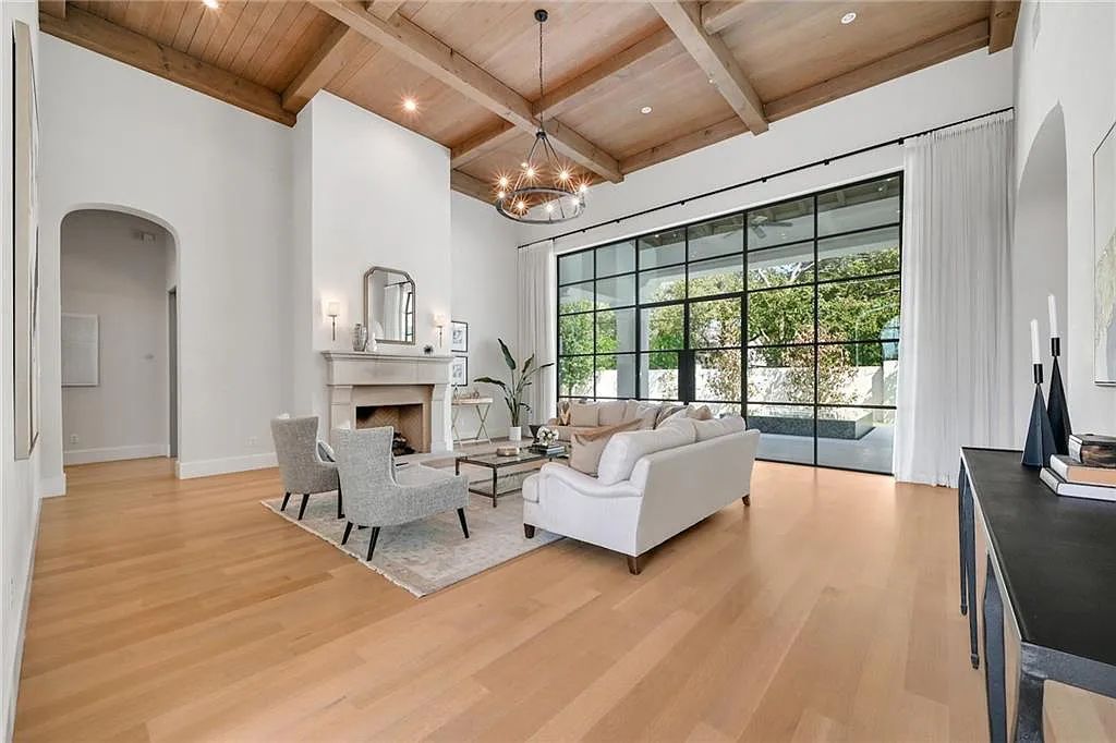 The Home in Austin, an immaculate modern estate nestled in the peaceful and tree-filled neighborhood of Rollingwood features resort-style backyard with a pool and spa, a covered outdoor kitchen is now available for sale. This home located at 4713 Timberline Dr, Austin, Texas