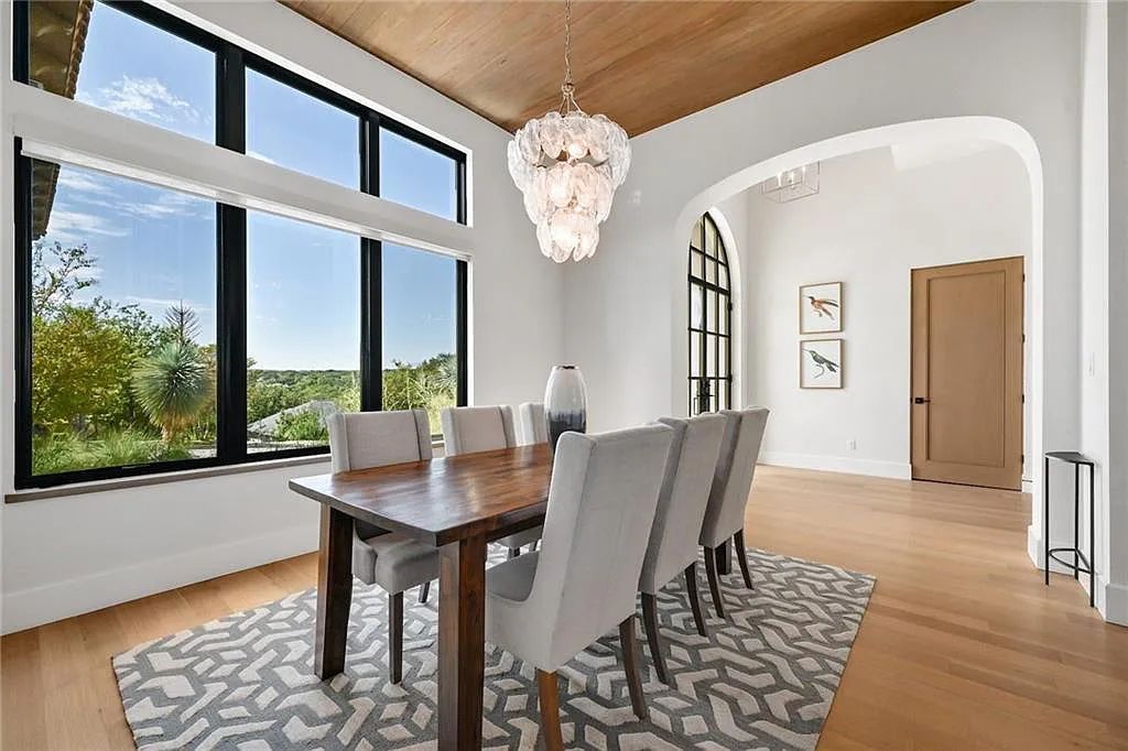The Home in Austin, an immaculate modern estate nestled in the peaceful and tree-filled neighborhood of Rollingwood features resort-style backyard with a pool and spa, a covered outdoor kitchen is now available for sale. This home located at 4713 Timberline Dr, Austin, Texas