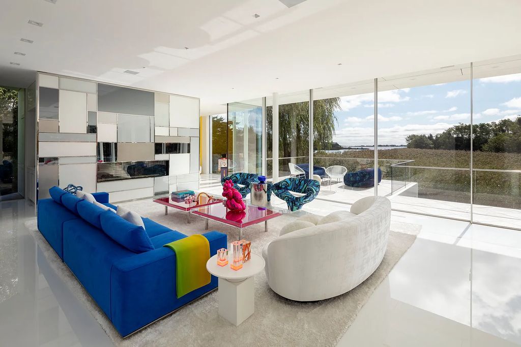 34 Cobb Isle Road, Water Mill, New York is a contemporary architectural masterpiece by renowned architect Roger Ferris overlooking Mecox Bay and the Atlantic Ocean, with 2 docks, plus a fully restored guest house on its own single and separate lot.